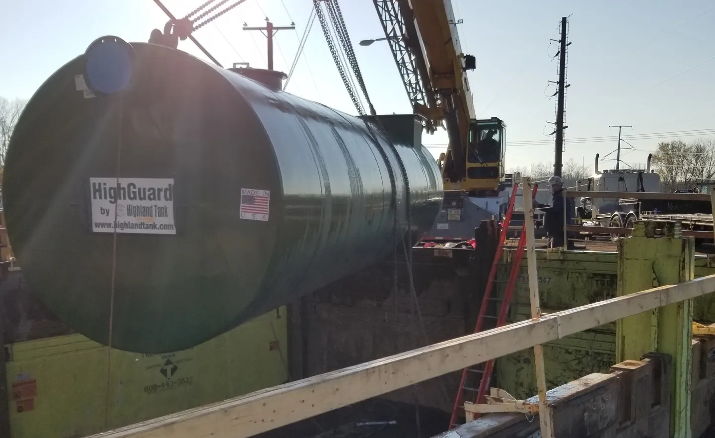 Oil and water separator tank being installed