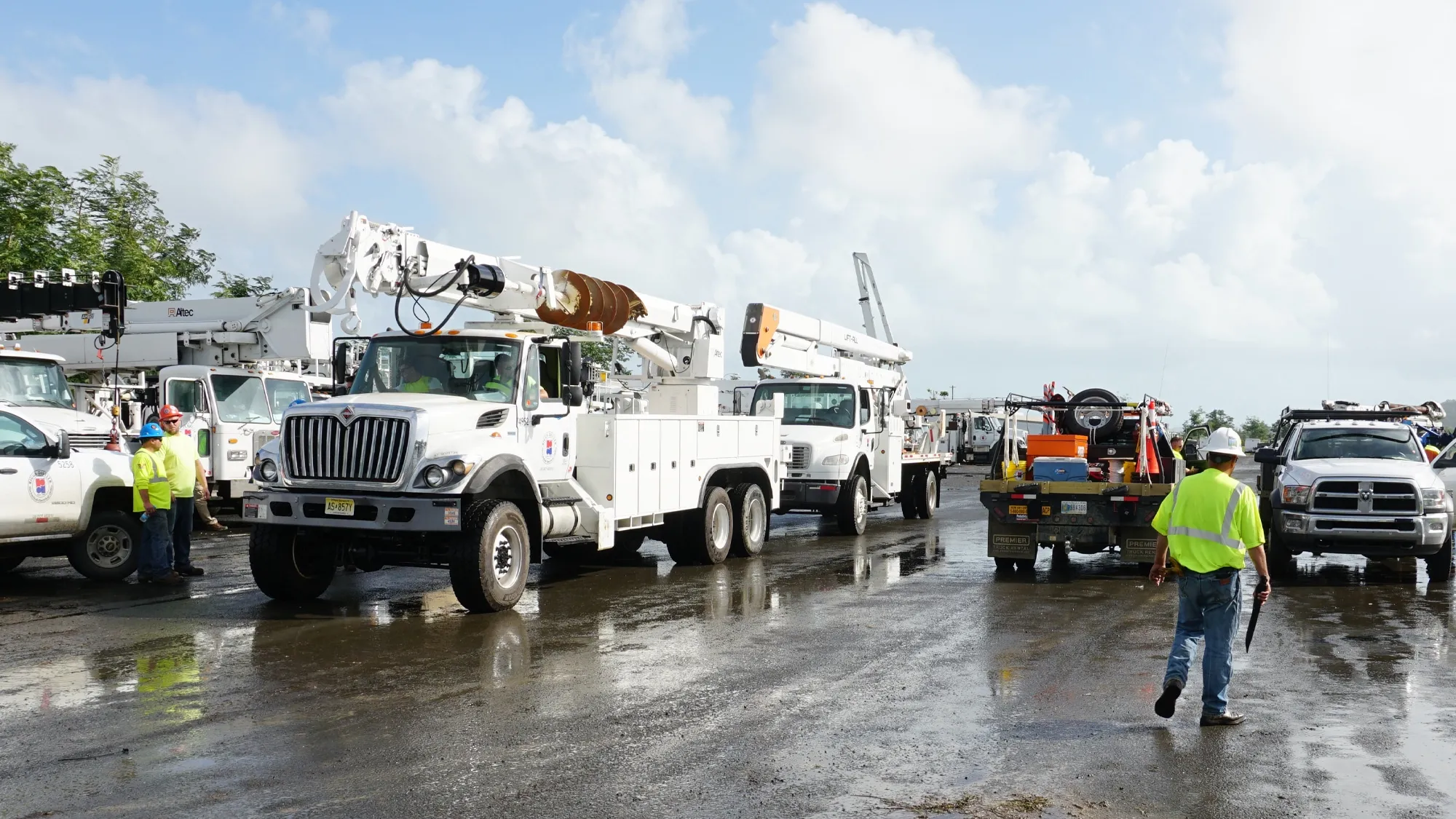 Photo of trucks and workers