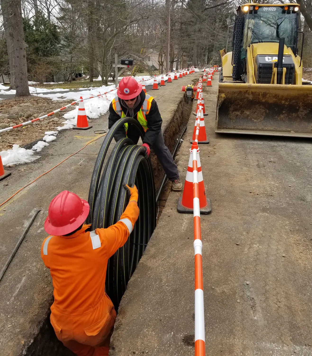 Gas Crew Placing coiled lines